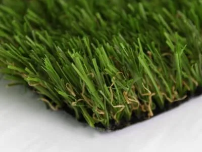 Cut edge of artificial grass showing the depth of the pile