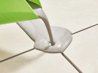 Jointing compound being poured into the joint between two slabs